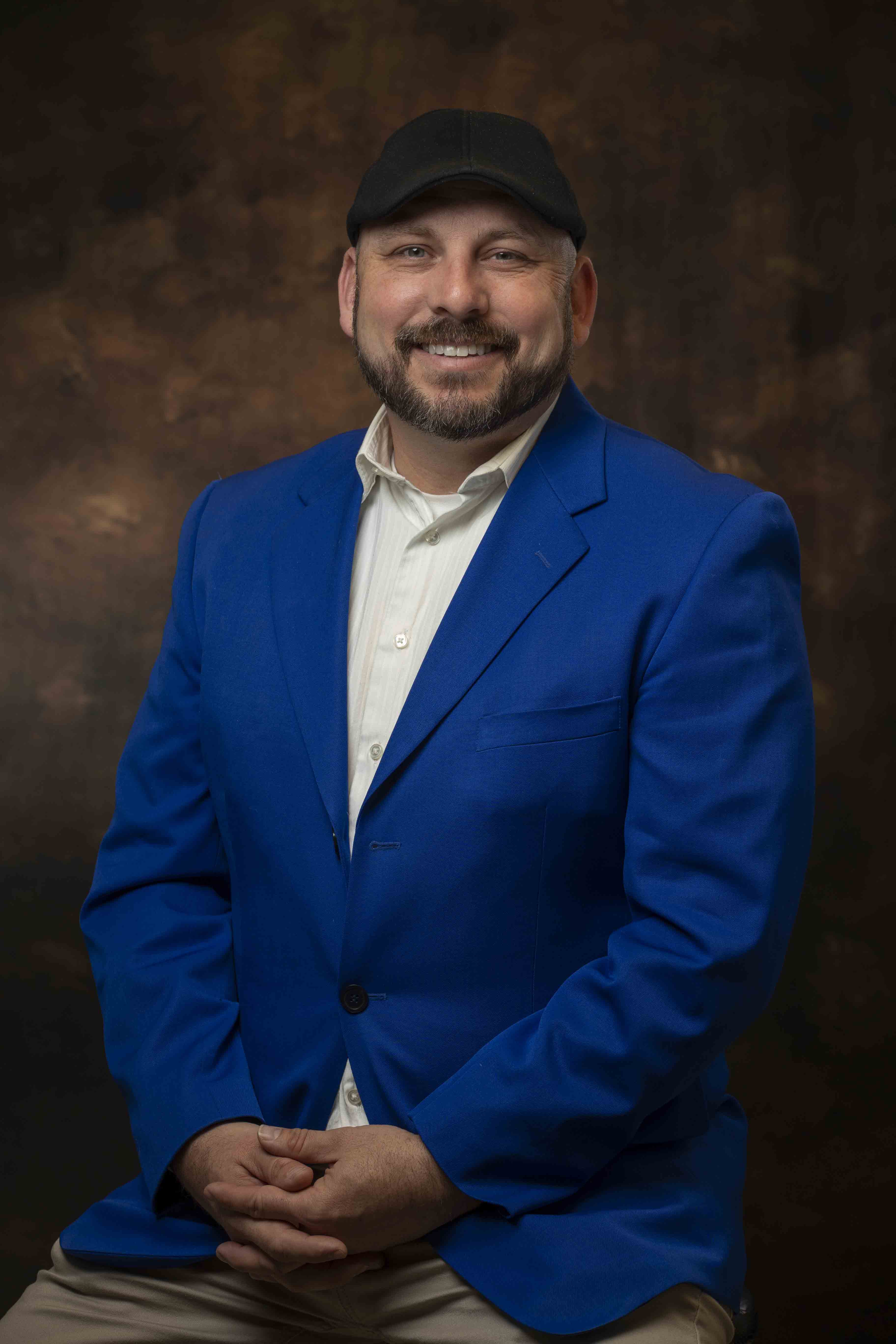 Portrait of Dr. Bryan Hains in blue jacket