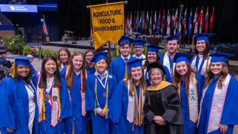 CLD graduates with Dr. Tanaka at commencement