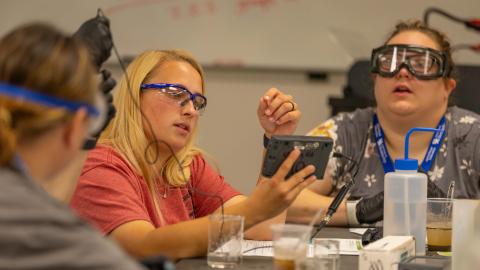 Students work on electronic tools in the lab